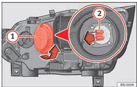 No compartimento do motor: lâmpada da luz de máximos.